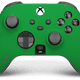 A photo of Scuf's Instinct Pro with a green faceplate.